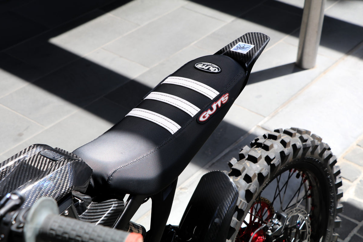 Guts Racing ribbed gripper seat cover close-up showing grip texture and ribs