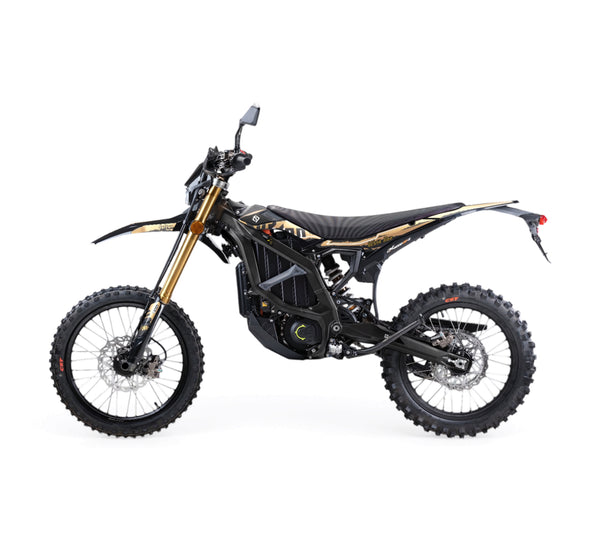 A black and gold off-road Sur-ron
electric dirt bike with knobby tires, a black seat, and a visible battery pack in the frame, photographed from a side profile on a solid white background.